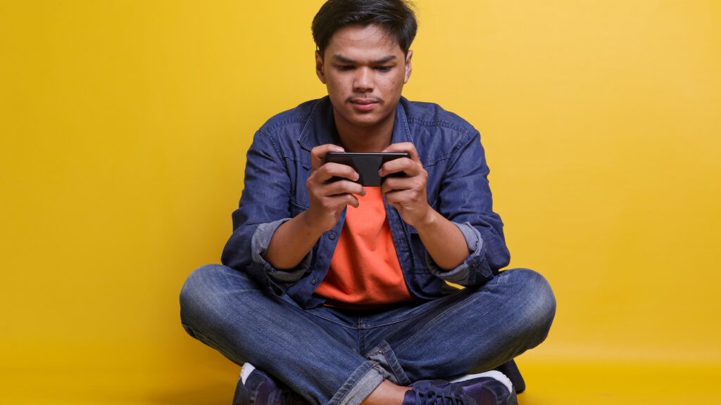 Man playing mobile games